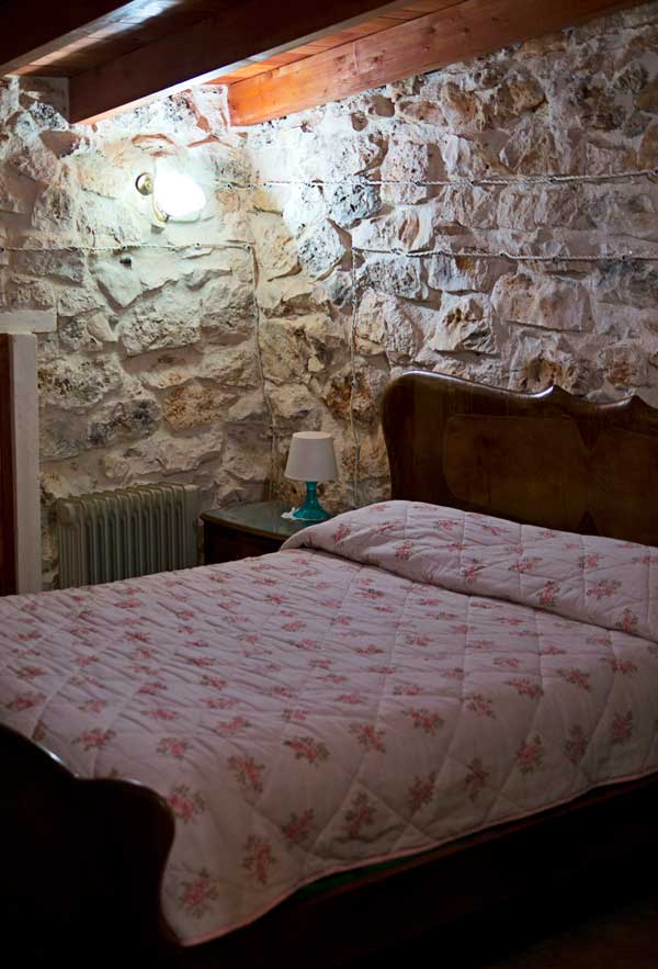 Bedroom inside Trullo House